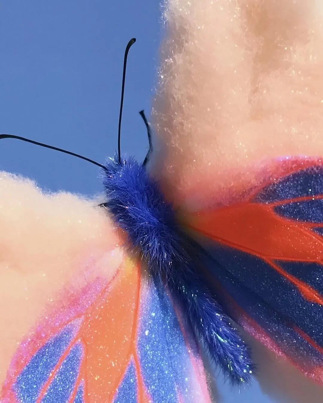 Soft-focus fabric in blue, orange and blush